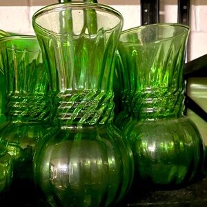 Set of three vintage green glass vases